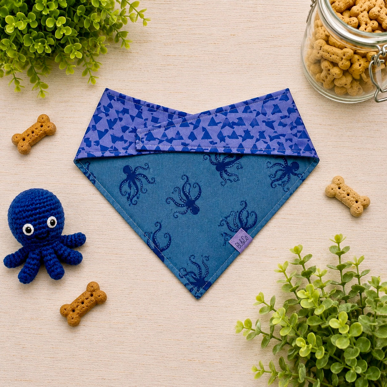 Blue reversible pet bandana with octopus pattern 
