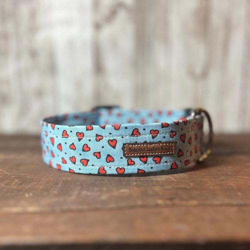 Dog collar with heart pattern on a wooden surface